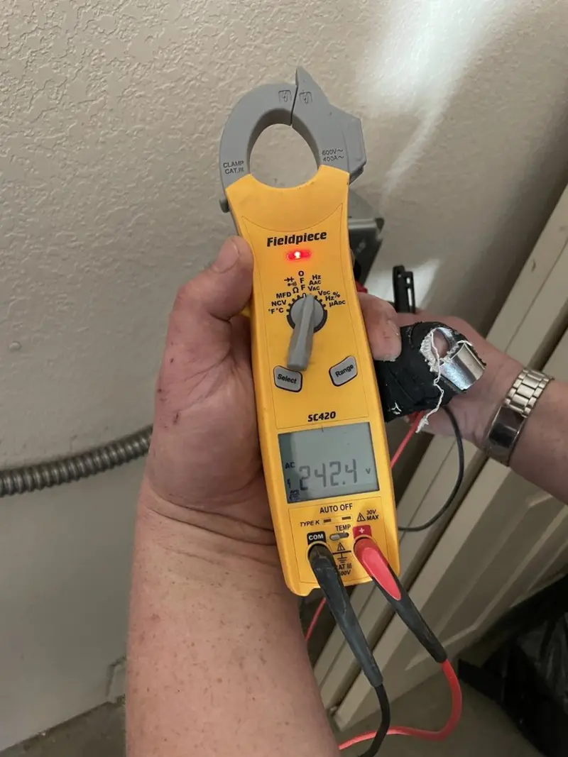 Voltage testing with clamp meter during Circuit Breaker Repair in West Gardiner